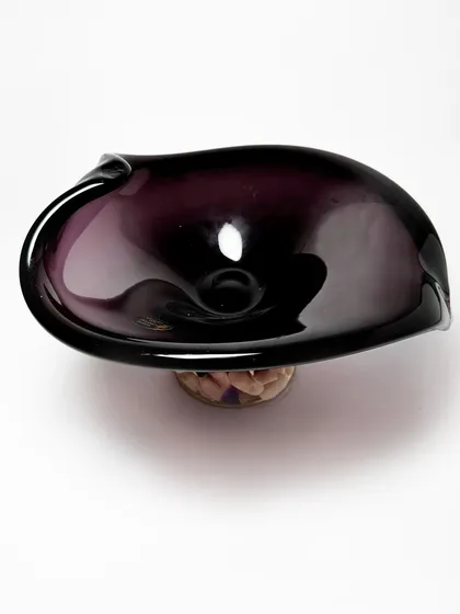 A top-down view of the amethyst Murano bowl, showing its organic, asymmetrical shape. This piece is a work of sculptural art, perfect for adding a touch of deep color and luxury to your decor.