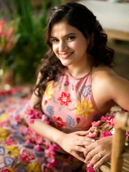 For Yogita's Mehendi, we created a look that was as fresh and vibrant as the floral setting. I focused on a natural, dewy base and a soft pink lip to complement her stunning floral outfit, making her look like she stepped right out of a fairytale.