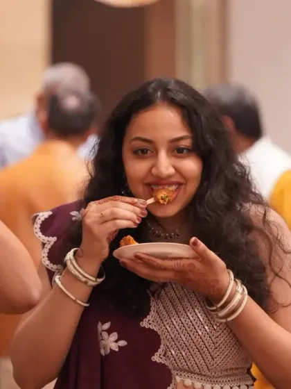 The simple joy of enjoying good food at a wedding. Candid shots of guests having a great time are essential to the memory of the day.