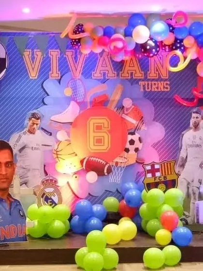 A multi-sport theme for Vivaan's 6th birthday, celebrating cricket and football with cutouts of famous athletes like MS Dhoni and Cristiano Ronaldo.
