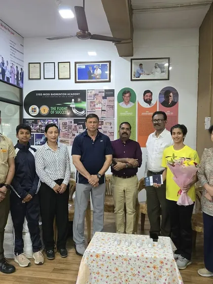 A group photo from Malvika Bansod's felicitation, with our coaches and local officials, celebrating a homegrown international star.