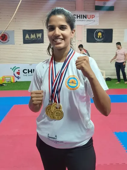 We are incredibly proud of our champions. Here, one of our dedicated students showcases her four gold medals from the 4th Mumbai City Kickboxing Championship. This is a testament to her hard work and the effectiveness of our training methods.