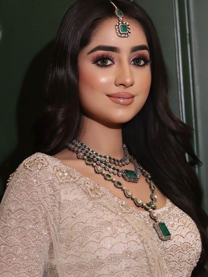 This portrait captures the complete harmony of the makeup, jewelry, and outfit for a truly stunning engagement look.