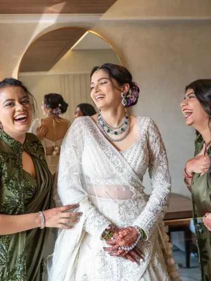 Pure joy and laughter between the bride and her bridesmaids. Capturing these genuine moments of friendship is a key part of the wedding story.