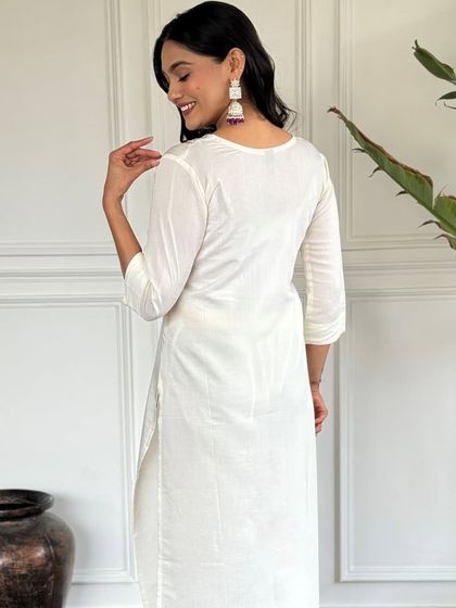 An elegant white chanderi kurta paired with a beautiful printed lavender dupatta. It's a classic combination that's perfect for a sophisticated, graceful look.