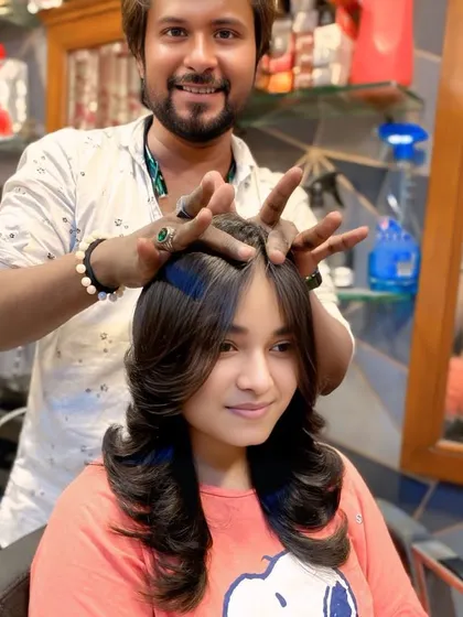 This client wanted a classic layered cut with lots of body. I styled it with an outward curl at the ends to emphasize the different lengths and create a soft, glamorous finish.