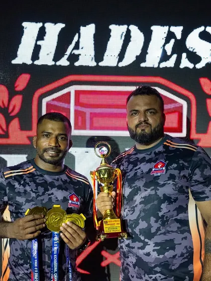Two of our coaches with the team trophy from Hades MMA. We lead from the front and celebrate as a team.