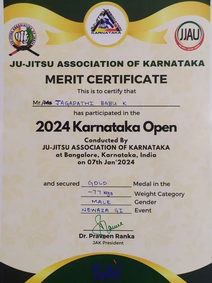 A close-up of the Gold Medal certificate from the Ju-Jitsu Association of Karnataka for the -77kg Gi event. The official proof of a hard-fought victory.