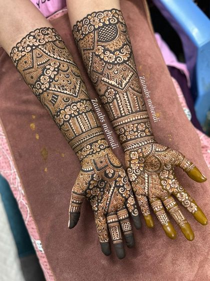 A full bridal design for engagement bride Shireen, with intricate patterns covering both hands and arms.