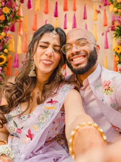 A fun selfie moment during a colorful Haldi ceremony. This candid shot captures the joy, energy, and modern spirit of today's wedding celebrations.
