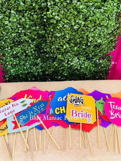 A collection of fun and cheeky photo booth props for the bride's team, including 'Team Bride' and 'Swag Wali Bride'.