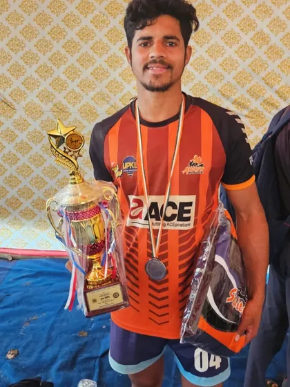 An academy player with his trophy and medal after his selection for the Under-18 National Championship.