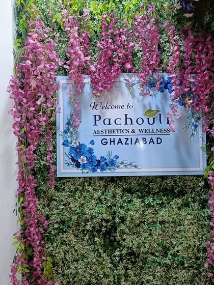 Our welcome sign at the Ghaziabad clinic, surrounded by a wall of greenery and flowers. This represents our philosophy of blending science with nature.