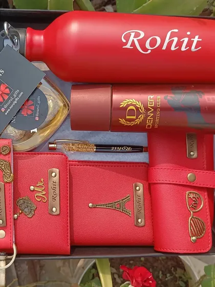 For the one who loves red, this vibrant gift hamper is a perfect choice. It features a full set of personalized red accessories including a wallet, passport holder, eyewear case, keychain, pen, and a matching temperature bottle.