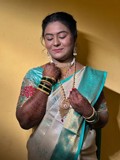 This shot highlights how the jewelry and makeup work together to create a harmonious look.