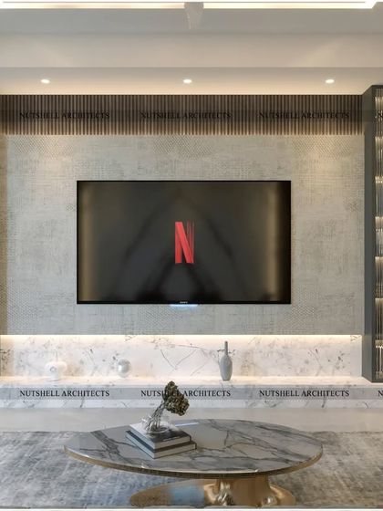 This TV unit combines a concrete-finish panel with fluted glass display cabinets. The backlighting in the cabinets and below the console adds a soft, ambient light to the room, making it perfect for movie nights.