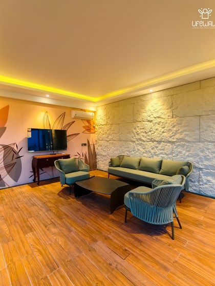 The interior of one of my custom rooftop rooms. This space is designed as a comfortable lounge with a feature wall, elegant seating, and full climate control, making it usable year-round.