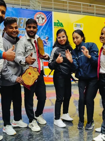 With my friends and fellow coaches. The taekwondo community is a close-knit one.
