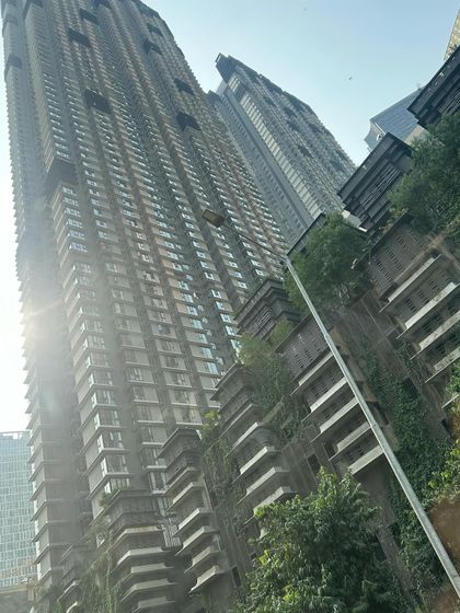 The dramatic architecture of Mumbai's high rises. This shot captures the urban, bustling side of the city.
