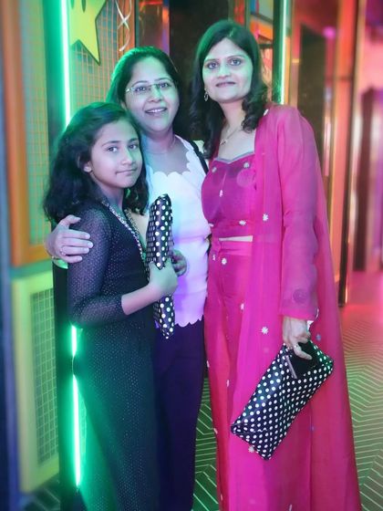 A mother, daughter, and grandmother pose together at an event. This three-generation photo is a beautiful keepsake that will be treasured.