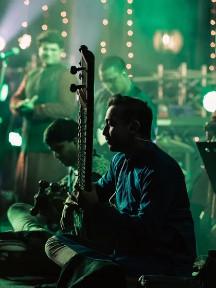 Intense and fun moments on stage with the Anirudh Varma Collective. This photo, with its dramatic green lighting, captures the energy of our live shows.
