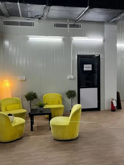 This casual lounge and waiting area, featuring bright yellow armchairs, was created as part of the IKEA office interior. It showcases our ability to design and furnish different functional zones within a single project.
