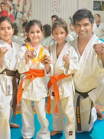 I believe in celebrating every achievement. Here I am with some of our youngest champions, proudly showing the medals they earned through their hard work and dedication in karate competitions.