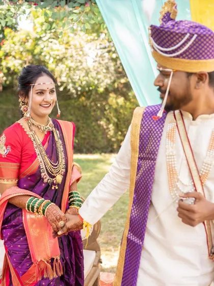 The look of love. Her makeup is soft yet defined, ensuring she looks perfect from every angle as she shares a special moment during her wedding ceremony.