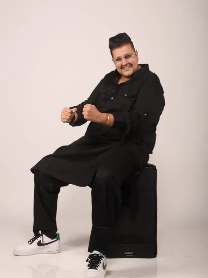A full-length shot showing my personal style, from the kurta to the sneakers. It's a blend of traditional and modern, just like my music.