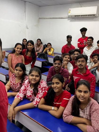 A selfie with students during the red-themed day of Navratri, capturing the vibrant energy in the class.