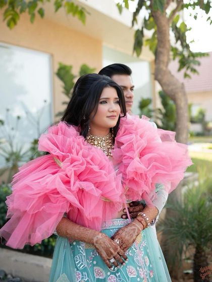 A romantic shot of the couple. The client's simple, wavy hairstyle is perfect for this dreamy look.