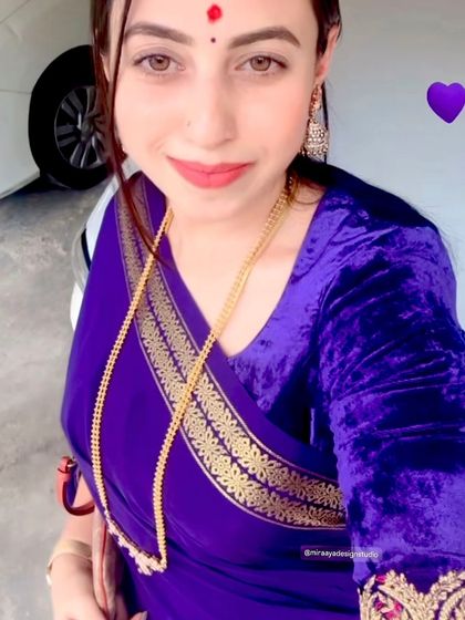 A client in a vibrant purple velvet blouse, showing how a simple, well-fitted blouse can make a statement.