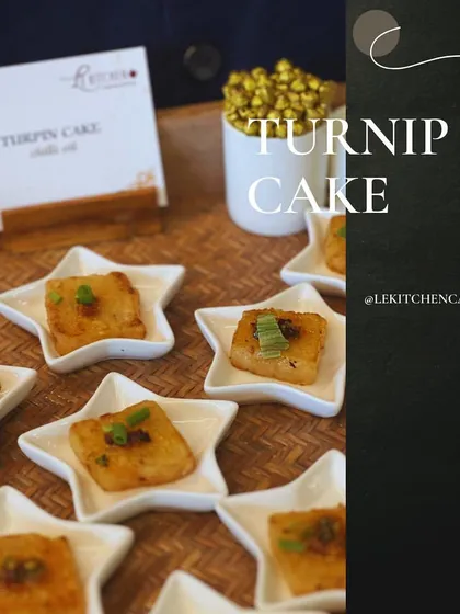 Savory Turnip Cake squares, pan-fried until golden and topped with spring onions. A delicious and unique offering.