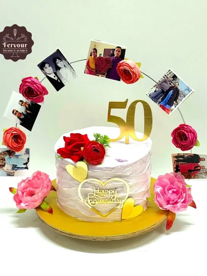 This 50th-anniversary cake tells a story with a beautiful arch of the couple's photos through the years. The cake itself is a delicious butterscotch flavour, decorated with fresh flowers.
