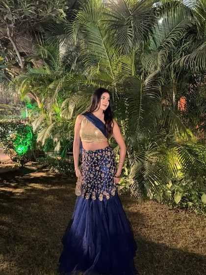 Another angle of the blue lehenga, showing its beautiful embroidery and flow.
