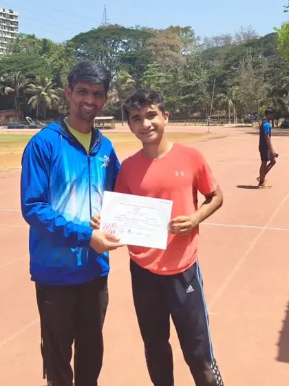 Coach Firoz Ustad presents Yuv Vora with his certificate. This moment captures the pride and mentorship that defines our coach-athlete relationships.