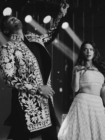 The energy and joy of a couple's dance, captured in a single black and white frame. This is the feeling we aim for in every performance.