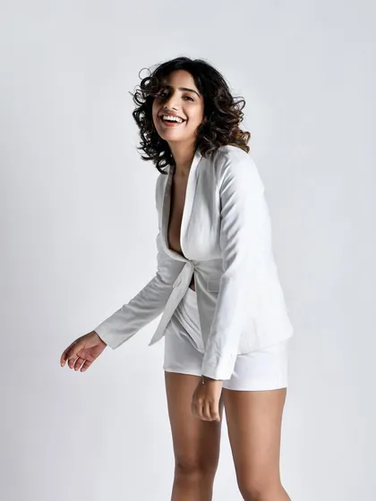 A candid, in-motion shot that feels authentic and full of life. It breaks the static nature of studio photography.