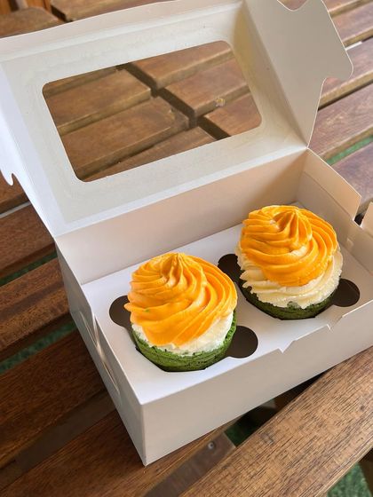 A box of our patriotic tri-color pupcakes, ready to be delivered. They are perfect for celebrating national holidays with your furry friend.