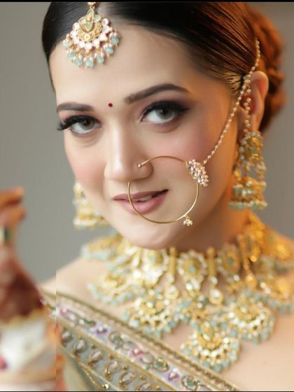 A confident and radiant bridal look. I teach my students how to pose their clients to capture the best angles and showcase the makeup beautifully.
