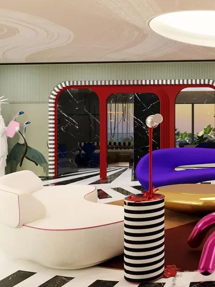 The "Whimsy Wonder" living room features a statue of liberty holding a pink bubblegum, adding a touch of humor and pop art flair to the eclectic space.