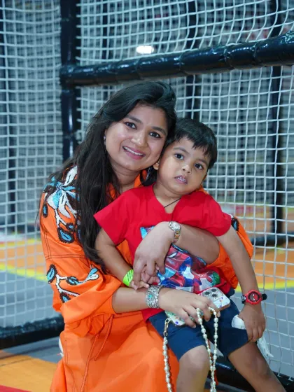A mother and son share a happy moment during a superhero-themed party. Our events are filled with opportunities for connection and fun.
