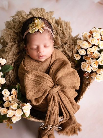 A top-down view of the brown-themed setup, demonstrating a classic and effective angle for newborn basket poses.