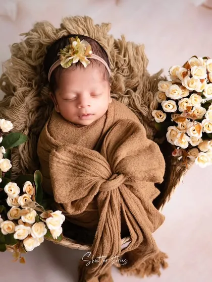 A top-down view of the brown-themed setup, demonstrating a classic and effective angle for newborn basket poses.