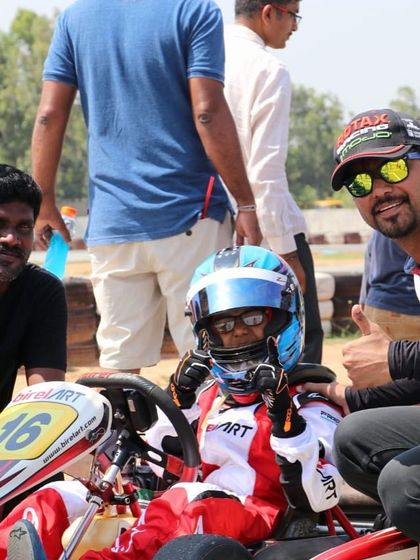 A moment of positive reinforcement on the grid, as our coaches give a thumbs-up to a young driver.