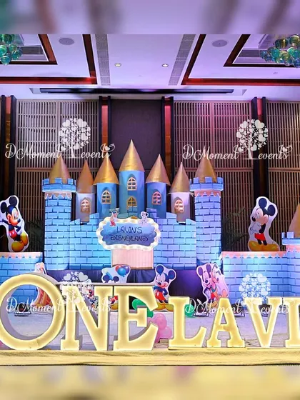 Another view of the impressive Disney castle stage. This shot highlights the scale of the setup, with Mickey Mouse cutouts flanking the central castle structure.