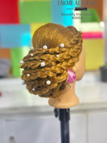 A side view of the intricate pearl-adorned braided updo, showing the 3D texture and detail.