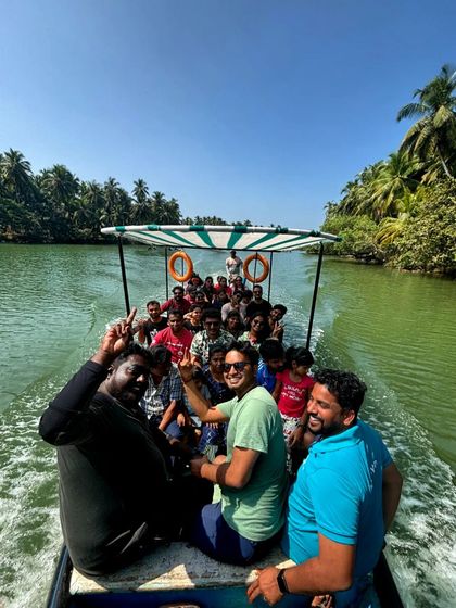 A view from the back of the boat, showing our happy group enjoying the ride through the backwaters.