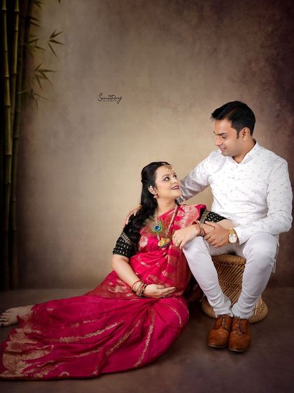 An intimate moment between a couple during their traditional shoot. The husband's gentle touch and their loving gaze create a powerful and emotional portrait.