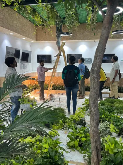 Careful planning and execution are key. Here, we are ensuring the lighting and plant placement work together to create the desired effect.